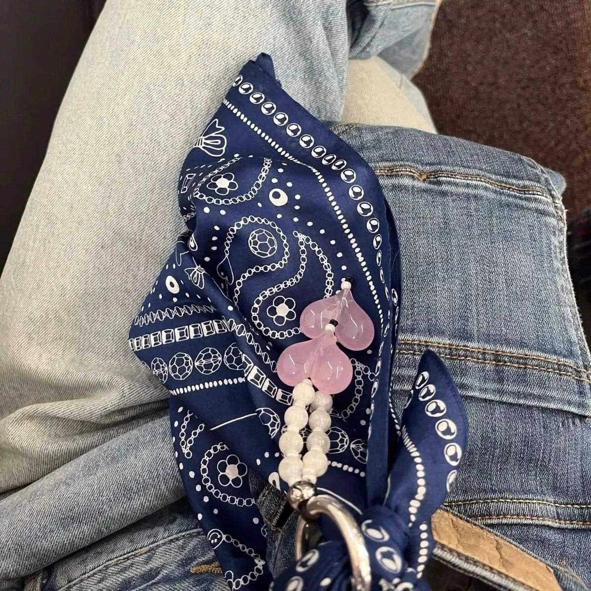 Model wearing the indigo Bead Parade bandana, demonstrating its versatile styling options.