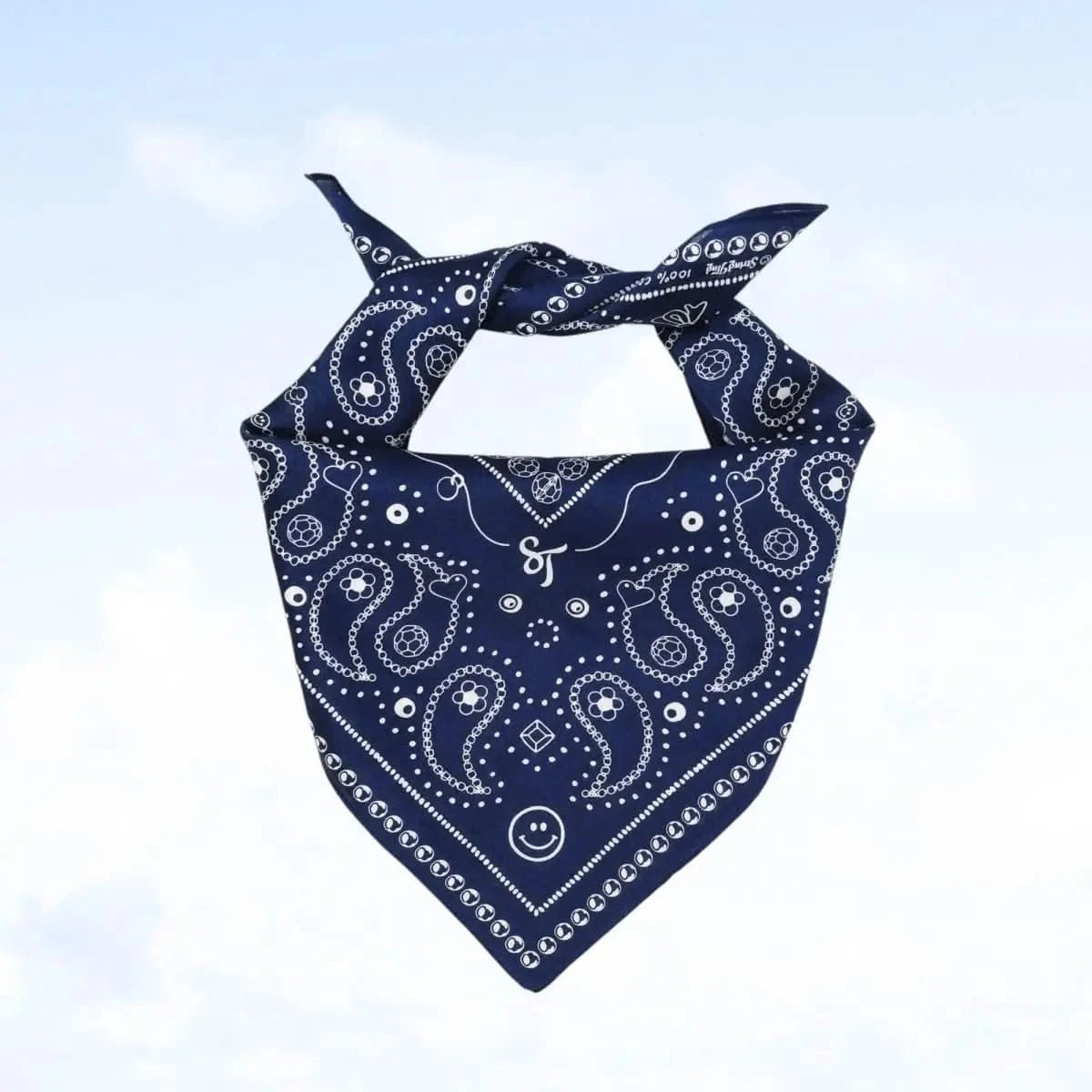 Close-up view of the indigo Bead Parade bandana, highlighting the detailed hand-drawn bead motifs and paisley elements.