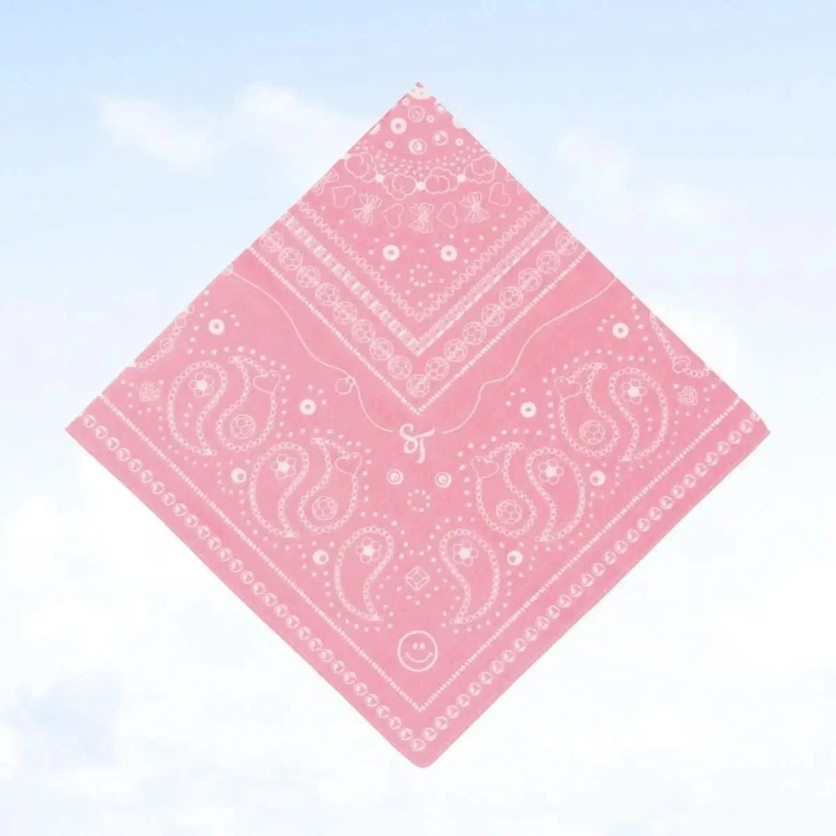 Bead Parade bandana in pink, neatly folded to show the full pattern of white bead and paisley designs on cotton fabric.