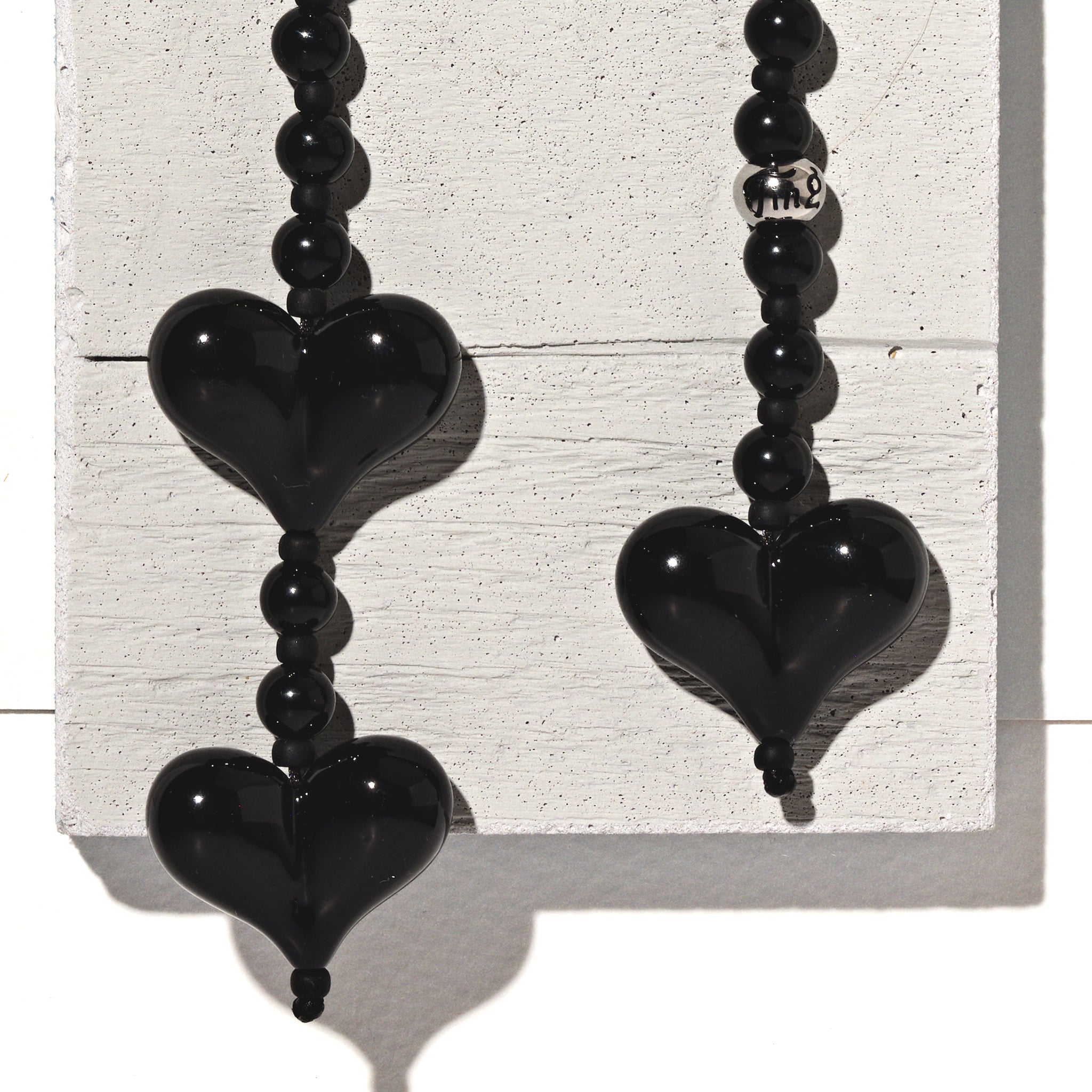 The Obsidian Lasso Ting Bag Charm