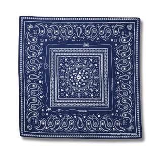 Flat-lay image showcasing the Bead Parade bandana in indigo, featuring intricate white bead-inspired patterns on soft cotton fabric.