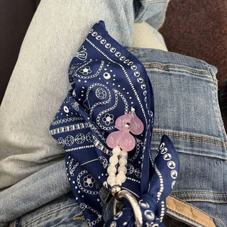 Model wearing the indigo Bead Parade bandana, demonstrating its versatile styling options.