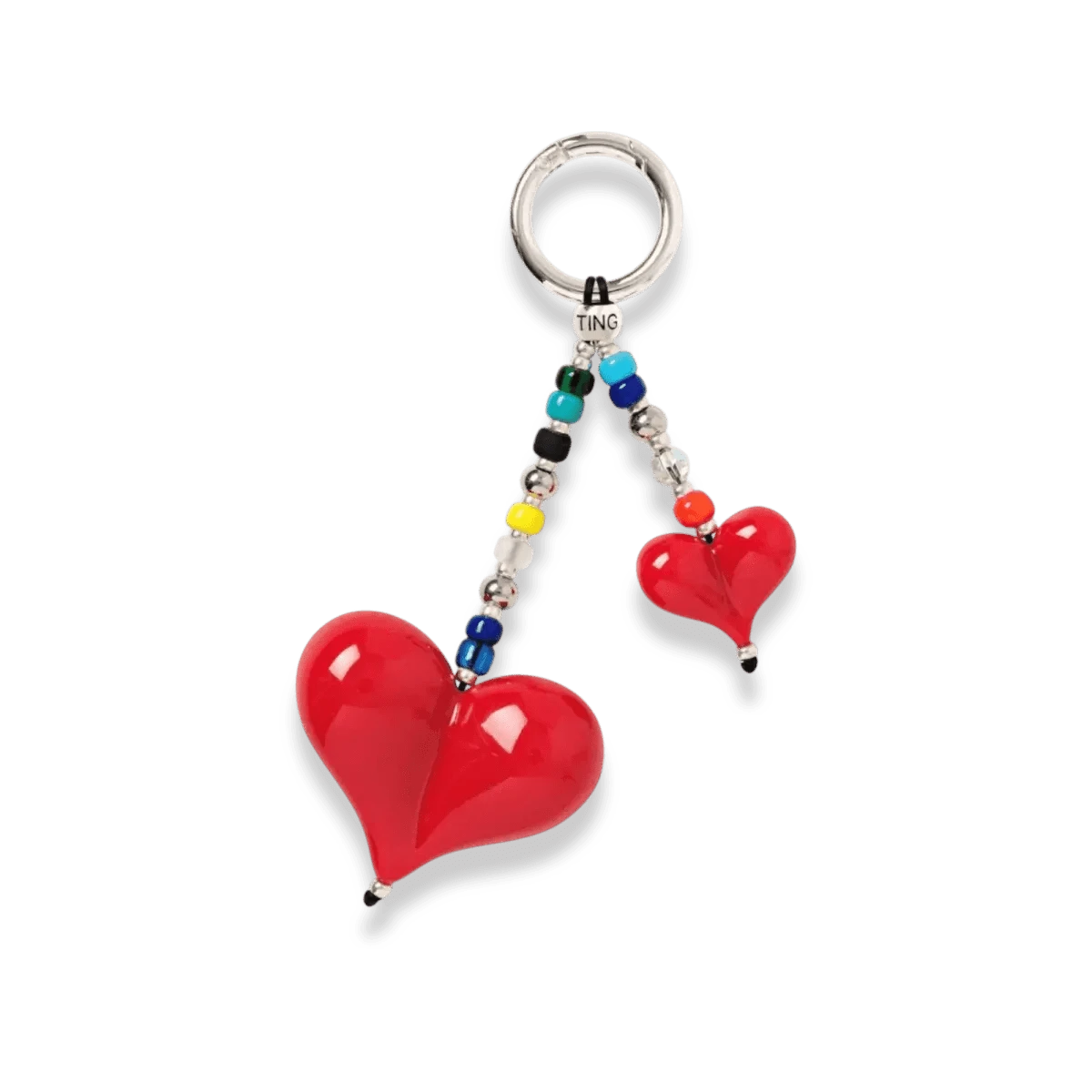 Image of the Big Love Shorty Bag Charm, showcasing its handcrafted design with vibrant red resin hearts, Japanese Miyuki beads, and Swarovski® crystals.