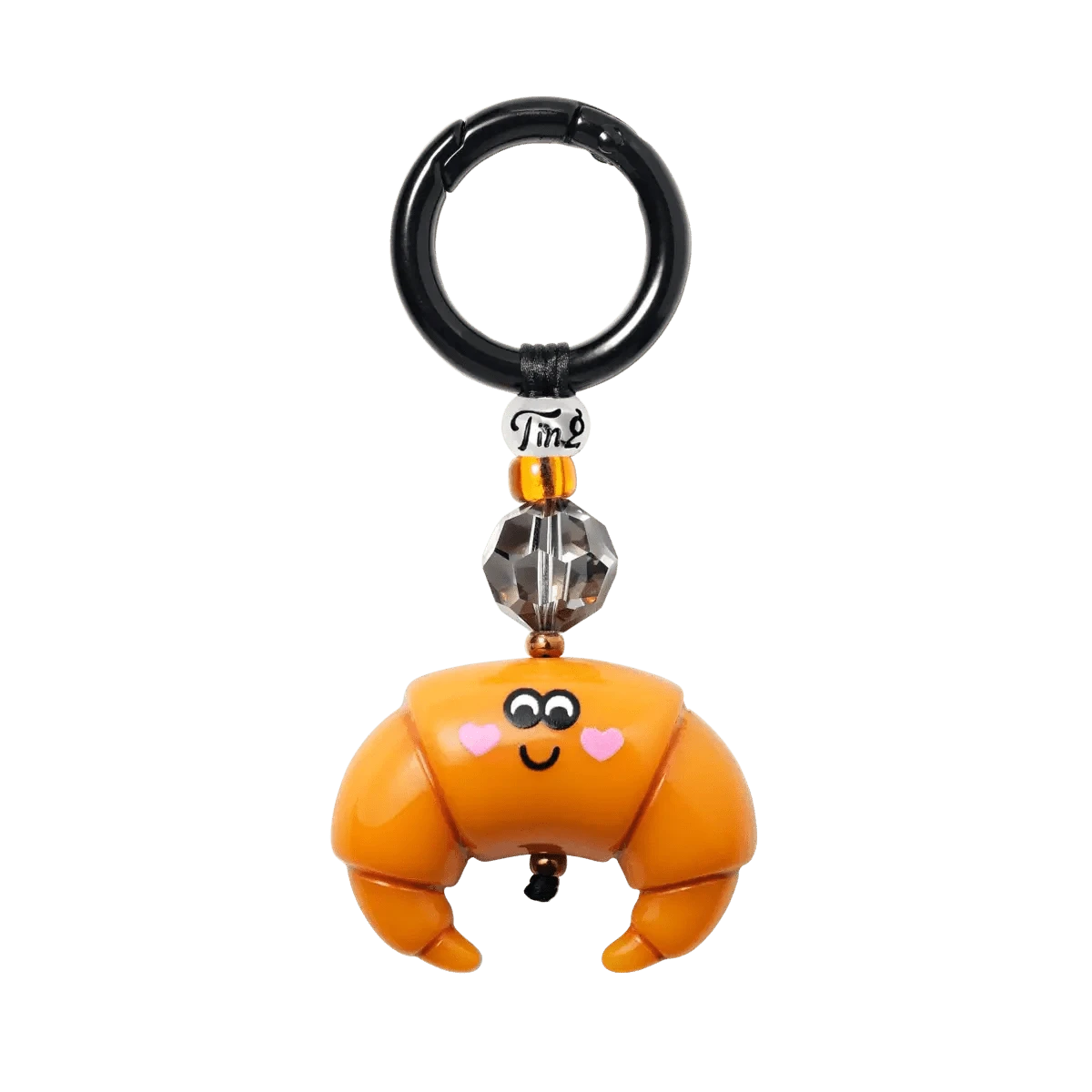 The Breakfast in Paris Bag Charm by String Ting, featuring a collectible city mascot bead, vibrant Japanese Miyuki® beads, and a large Swarovski® crystal, displayed on a white background.